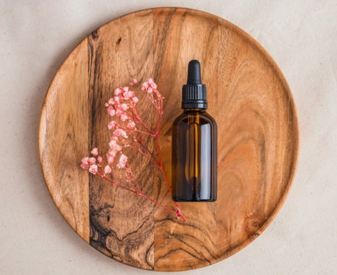 a bottle of perfume on a wooden table